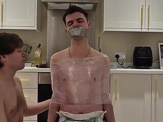 Diaper Boy Tied to a Chair