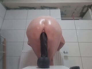 gay boy rides and fuckes a black dildo balls deep up his anal abyss