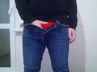 Young guy Andrew is jerking his cock by the window while he is alone
