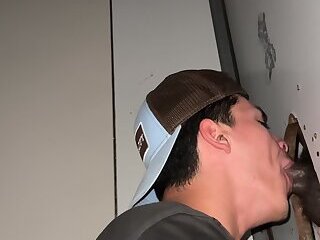 sucking a big black cock glory hole