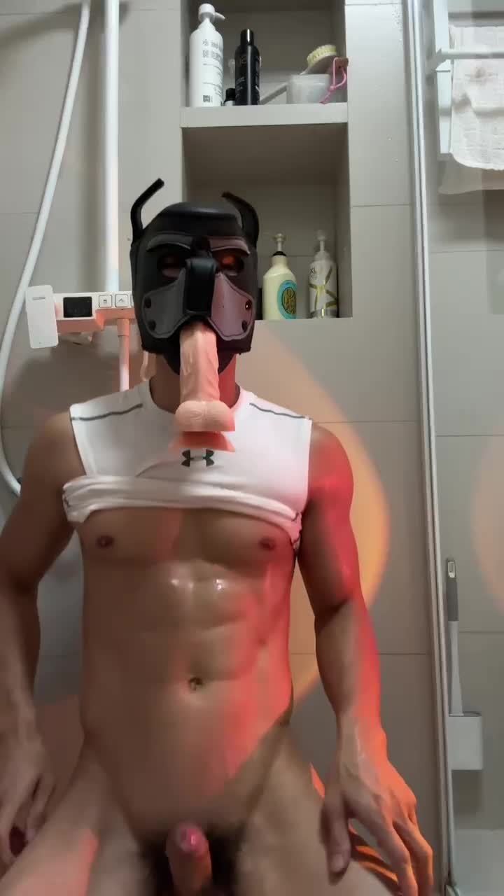 a man's hand reaches for a dildo