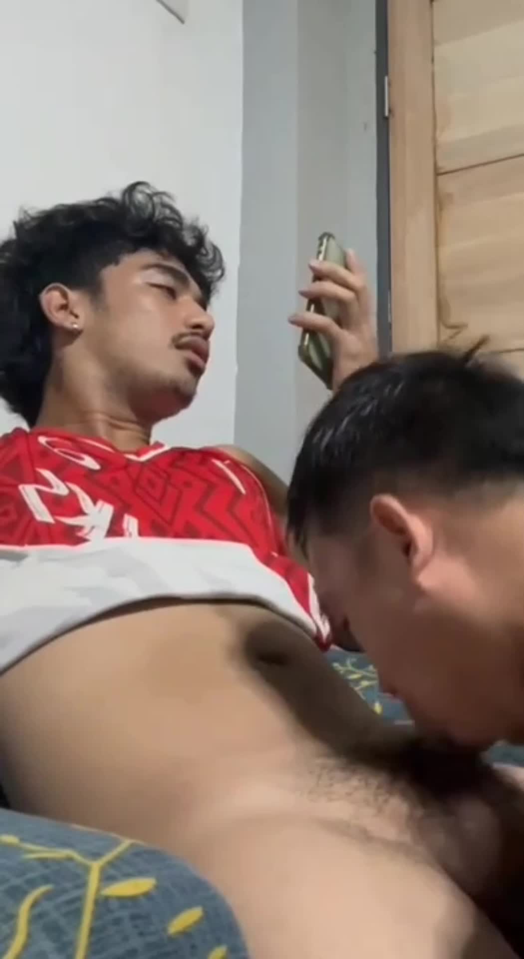 Fingers clutch a toned buttock tightening the hold in a sign of passion