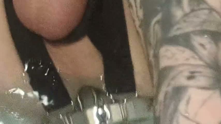 Enema, anal shower. Close-up view through anal mirror. Anal with water. Filling anal with water