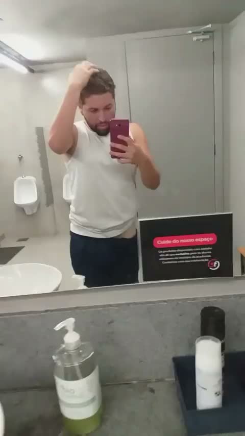 I almost got caught exposing myself in the gym bathroom, and the guys almost caught me.